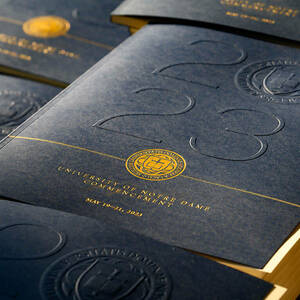 Blue booklets with 2023 embossed on the cover