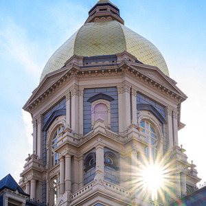 Closeup of the golden dome with sun shining through